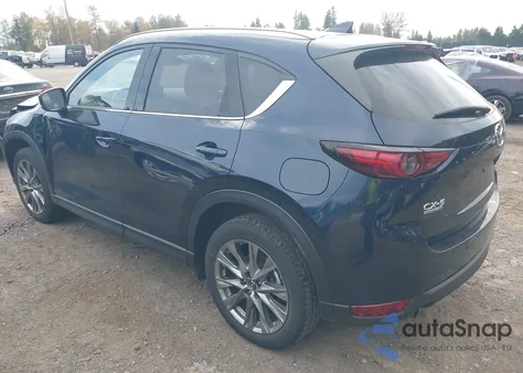 2021 Mazda Cx-5 Signature z USA, uszkodzony, nr VIN JM3KFBEY5M0339156